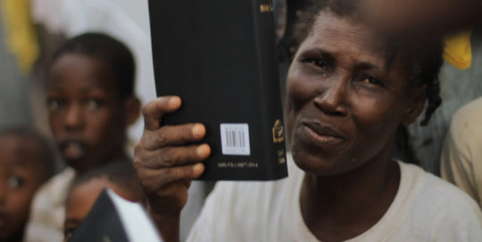 Hatian-women-gets-bible-after-receiving-Christ-and-praises-God-for-new-bible